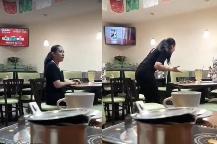 Mujer discute al vacío en un restaurante.