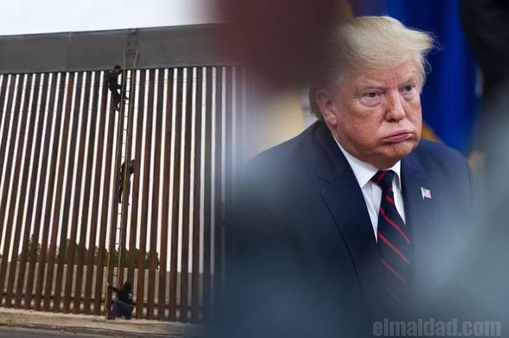 Migrante saltando el nuevo muro de Trump.