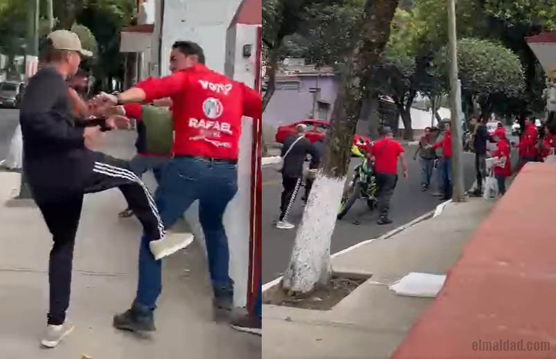 Rafael Montiel siendo pateado y tratando de calmar las aguas.