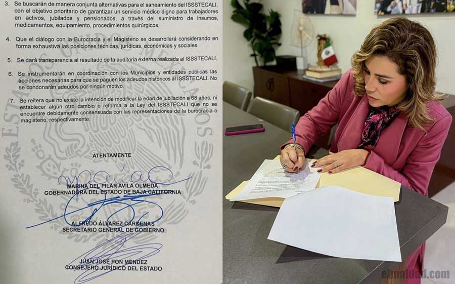 Firmando convenio y Marina del Pilar.